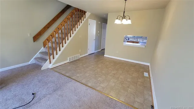 a view of a hallway with staircase