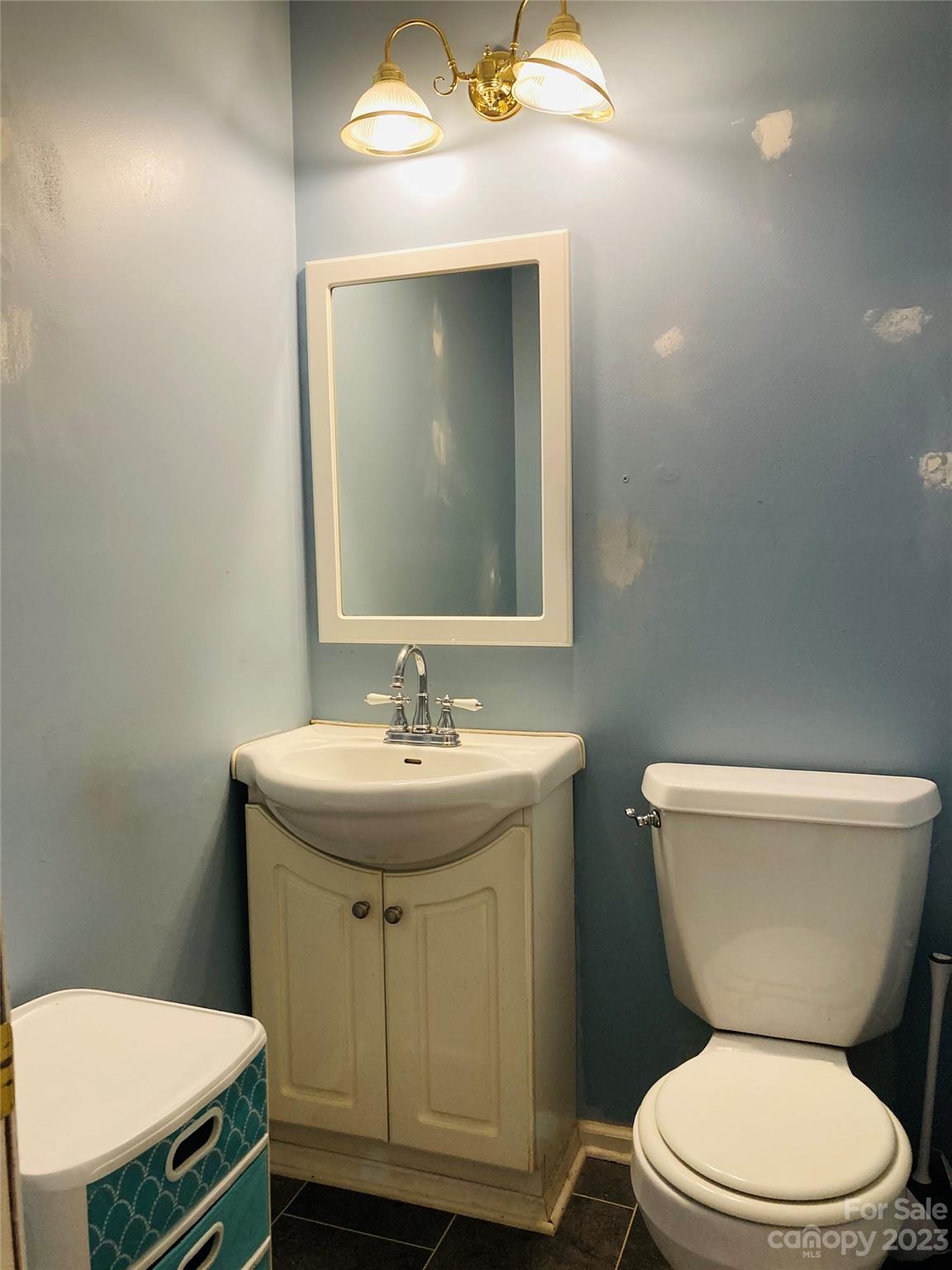 210 South Hillside Street Rutherfordton, NC 28139 - Photo 18 of 48 a bathroom with a toilet a sink and mirror