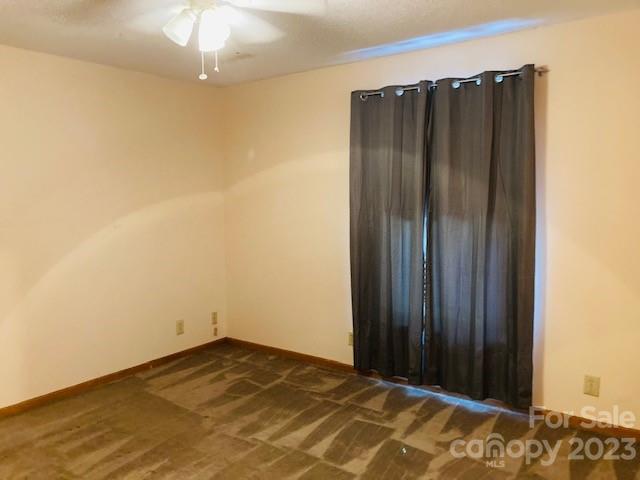 210 South Hillside Street Rutherfordton, NC 28139 - Photo 21 of 48 an empty room with a wooden door