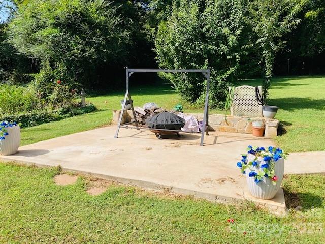 210 South Hillside Street Rutherfordton, NC 28139 - Photo 38 of 48 a view of a table and chairs in the garden