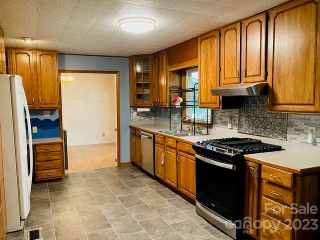 210 South Hillside Street Rutherfordton, NC 28139 - Photo 6 of 48 a kitchen with stainless steel appliances granite countertop a stove a sink and a refrigerator