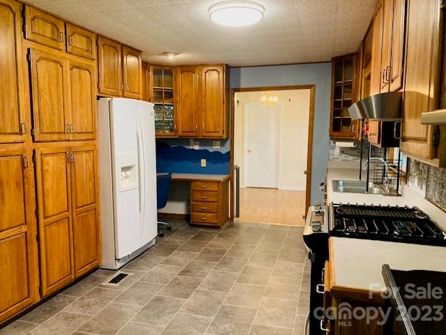 210 South Hillside Street Rutherfordton, NC 28139 - Photo 7 of 48 a kitchen with stainless steel appliances a refrigerator and cabinets