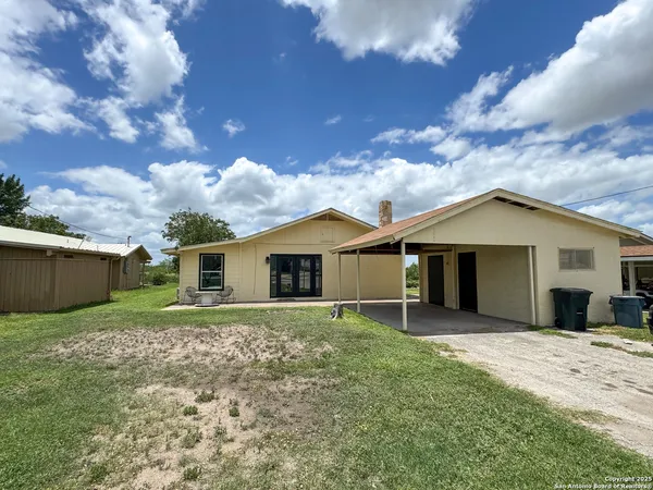 front view of a house with a yard