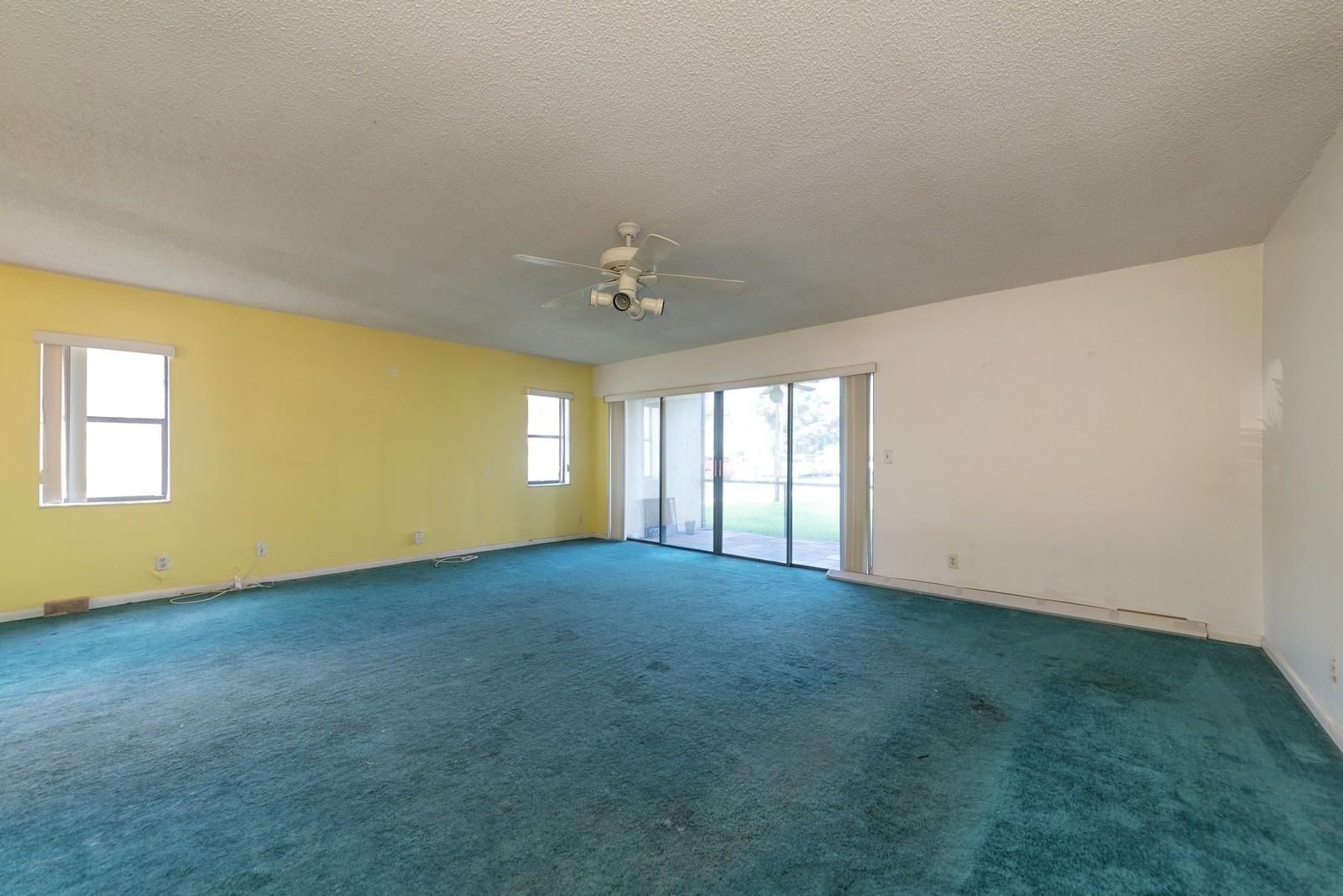 22485 Southwest 61st Way, Unit 136 Boca Raton, FL 33428 - Photo 3 of 15 03_22485SW61stWay136_93_LivingRoomDining