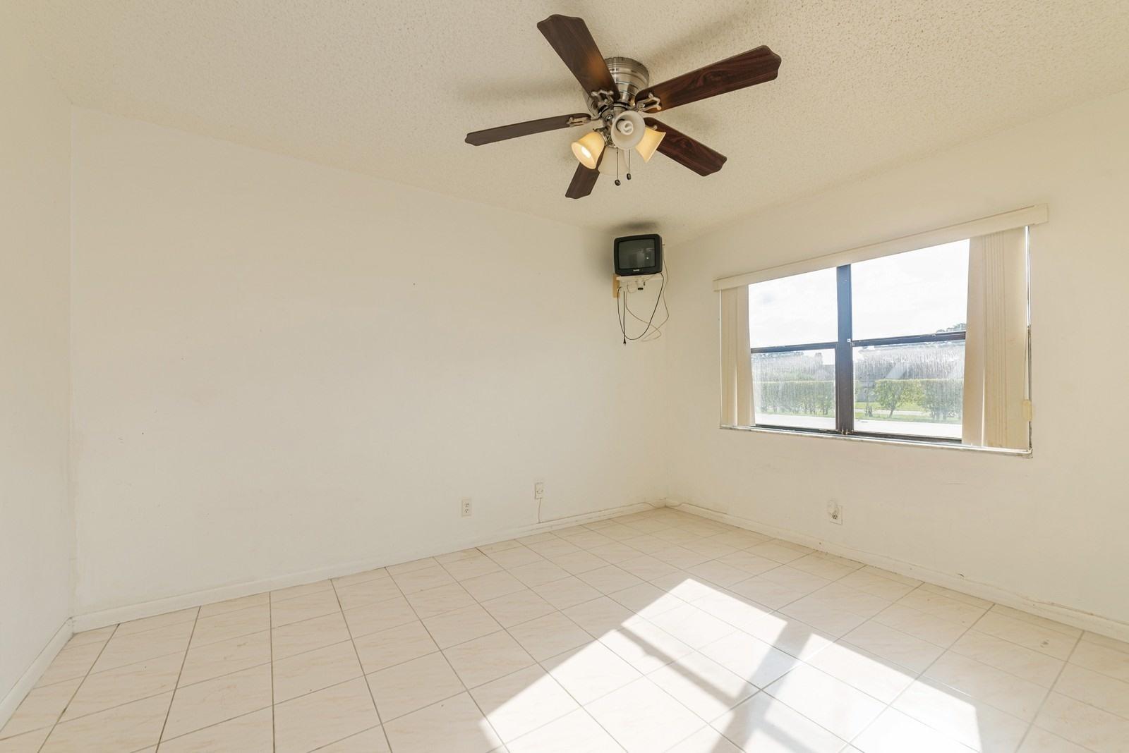 22485 Southwest 61st Way, Unit 136 Boca Raton, FL 33428 - Photo 6 of 15 06_22485SW61stWay136_3_FamilyRoom_Custom