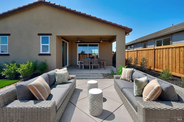 a outdoor living space with furniture and a potted plant