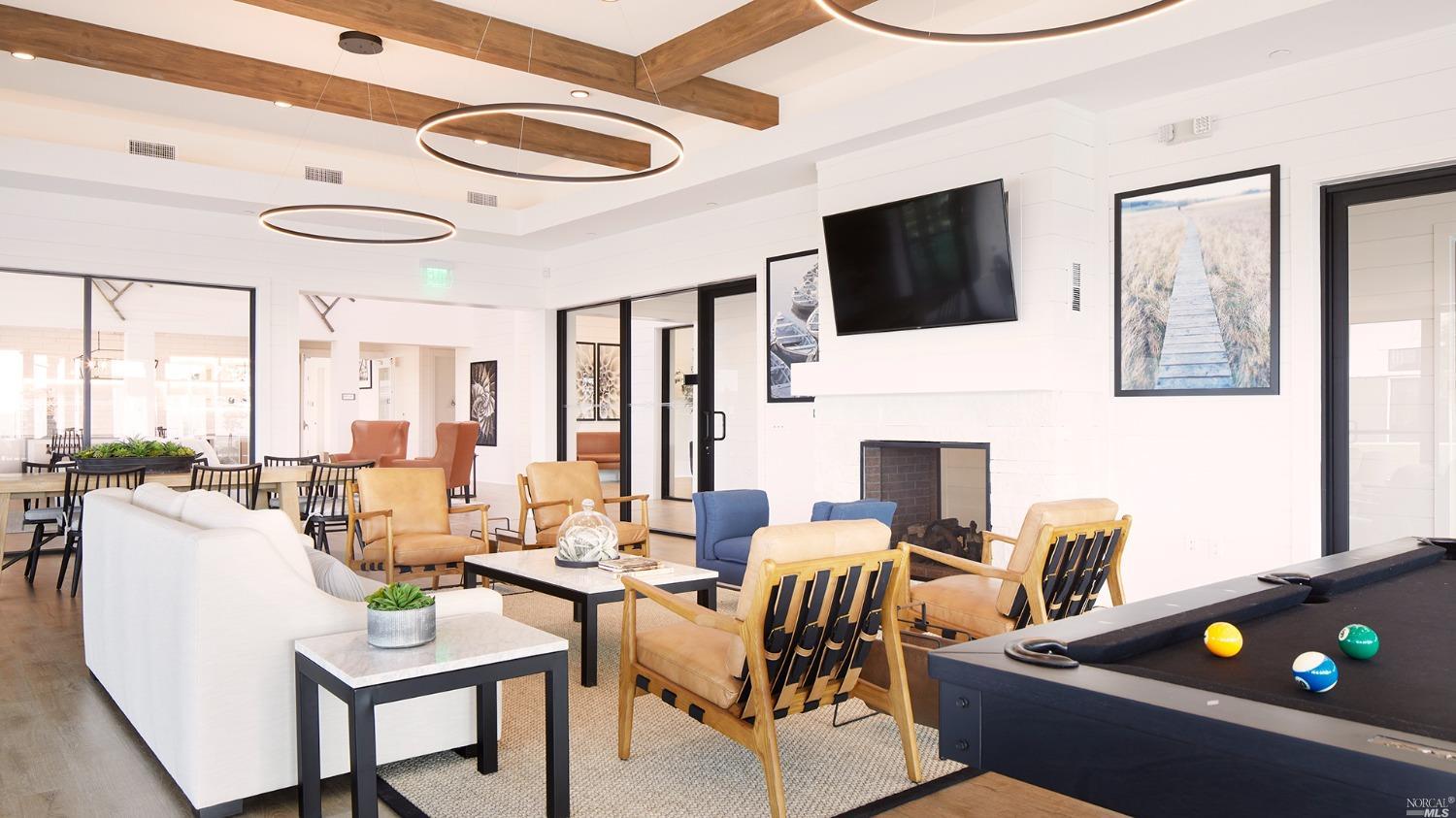 2438 Revival Lane Rio Vista, CA 94571 - Photo 38 of 40 a living room with furniture a flat screen tv and a floor to ceiling window