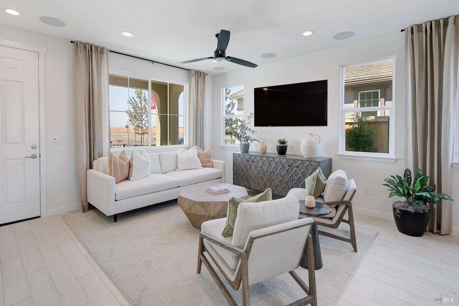 2438 Revival Lane Rio Vista, CA 94571 - Photo 7 of 40 a living room with furniture and a flat screen tv