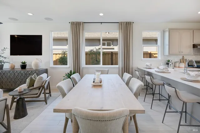 a dining room with furniture and window