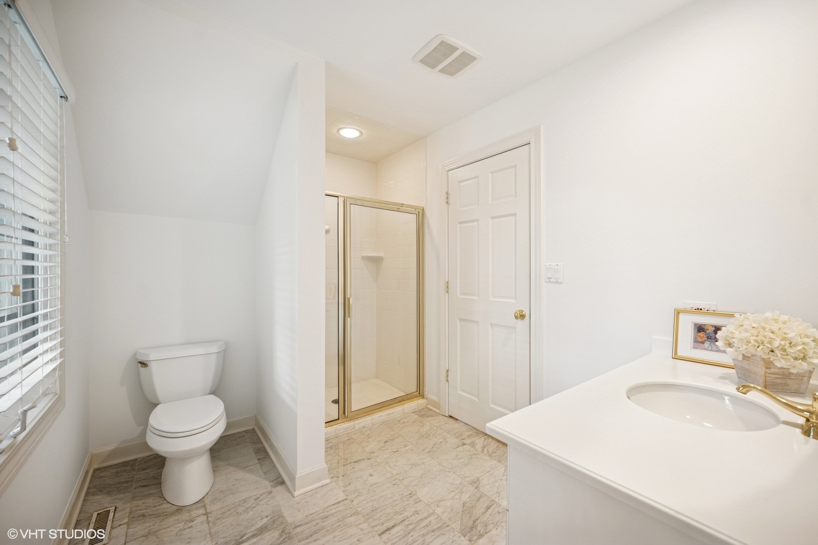 1118 Mt Pleasant Road Winnetka, IL 60093 - Photo 28 of 48 a bathroom with a toilet sink and a shower