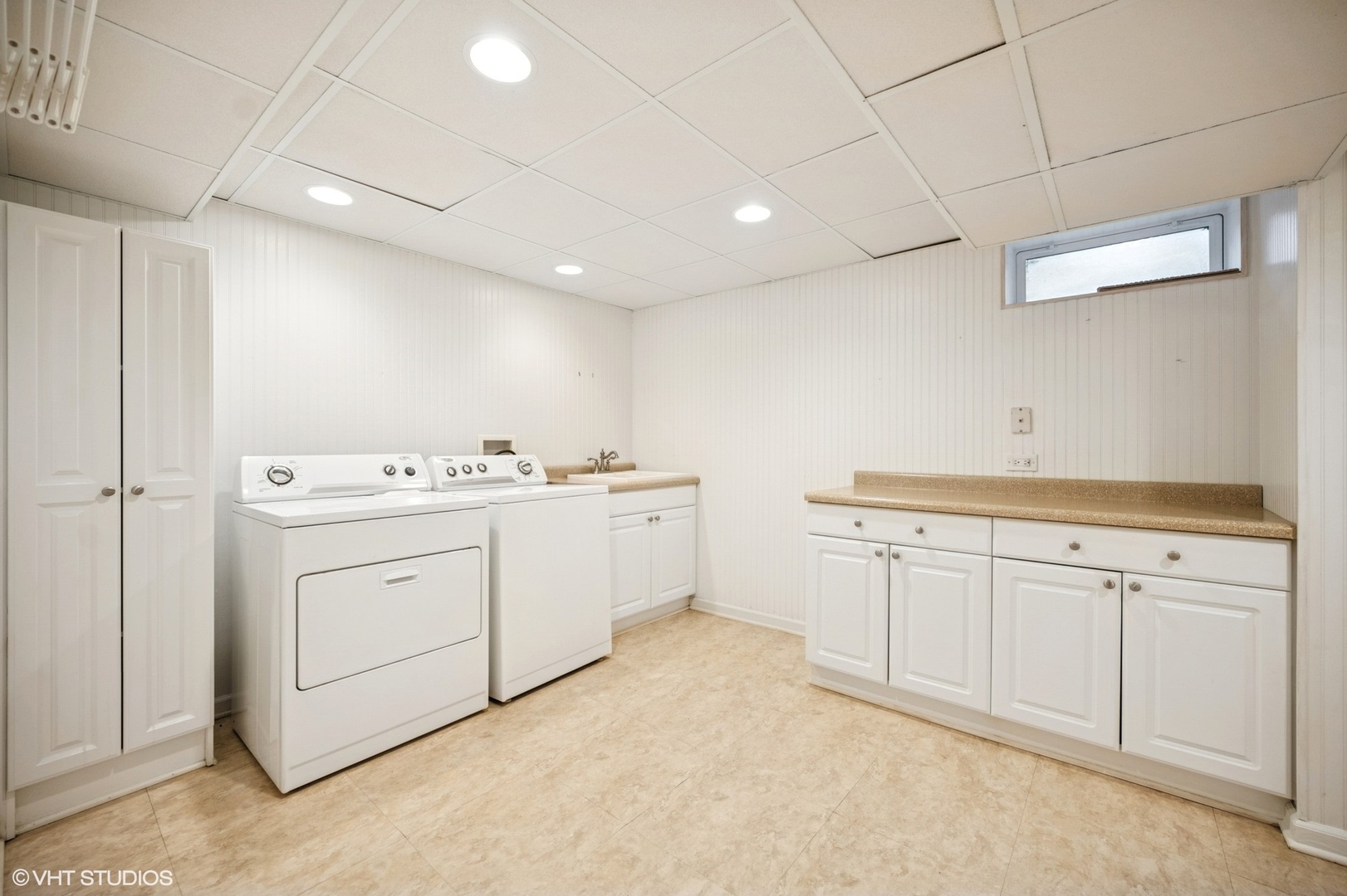 1118 Mt Pleasant Road Winnetka, IL 60093 - Photo 36 of 48 a view of a storage utility room with cabinets dryer and washer