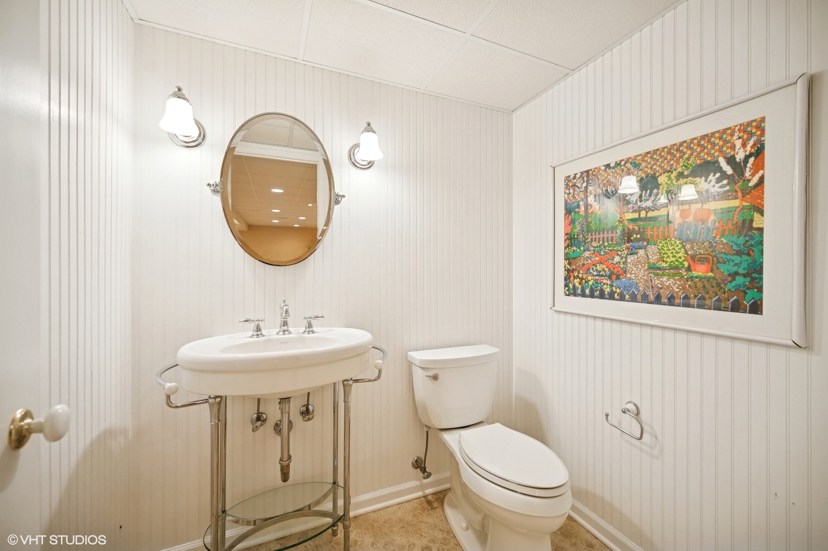 1118 Mt Pleasant Road Winnetka, IL 60093 - Photo 37 of 48 a bathroom with a toilet a sink and a mirror