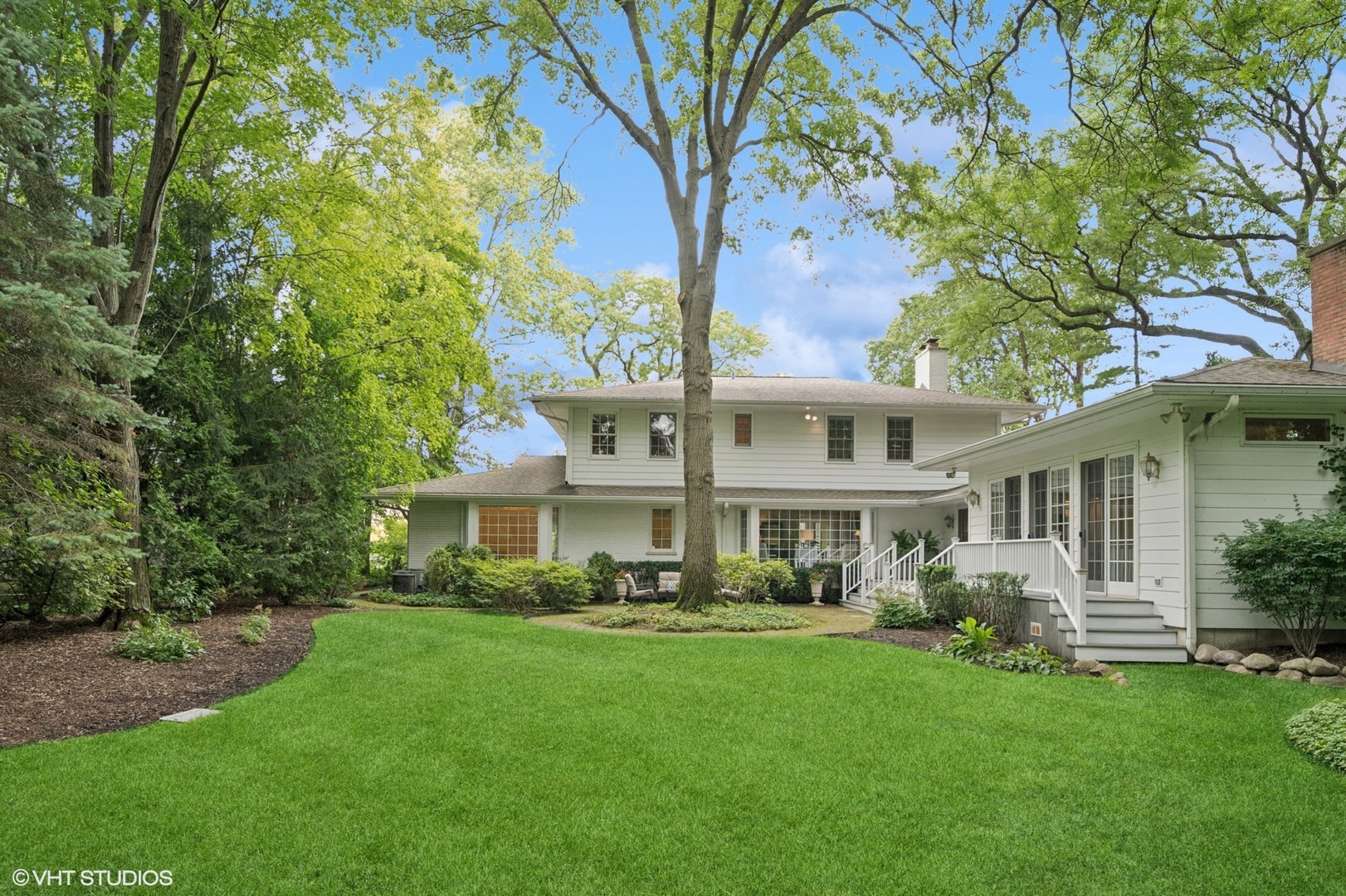 1118 Mt Pleasant Road Winnetka, IL 60093 - Photo 39 of 48 a front view of a house with a garden and plants