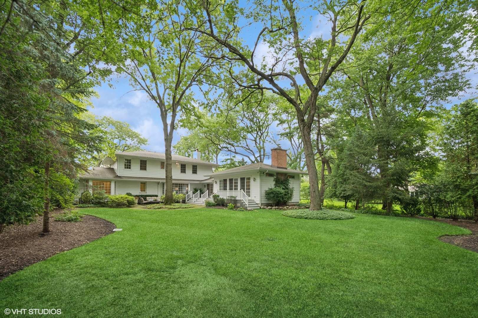 1118 Mt Pleasant Road Winnetka, IL 60093 - Photo 40 of 48 a view of a house with a big yard and large trees