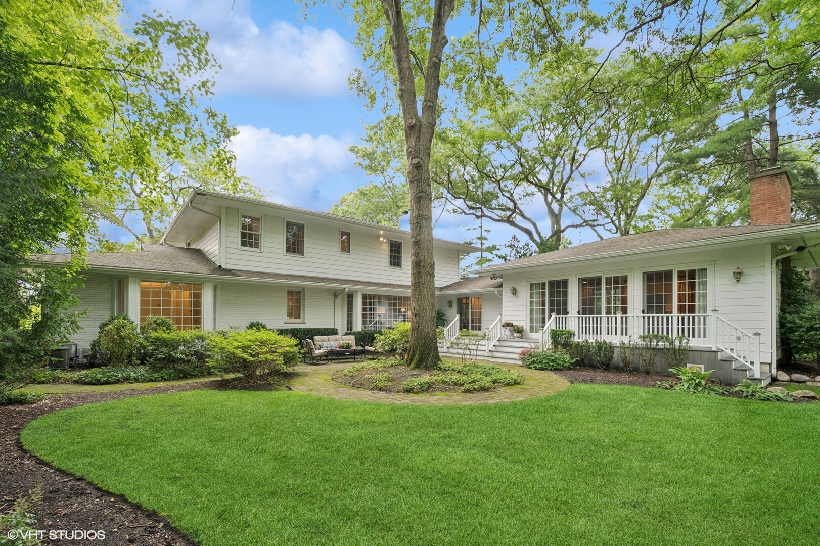 1118 Mt Pleasant Road Winnetka, IL 60093 - Photo 41 of 48 a front view of a house with a garden