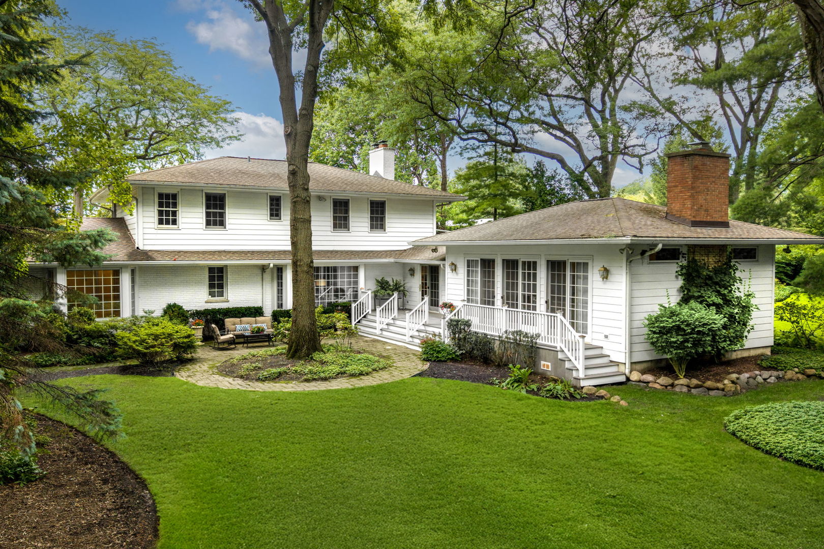 1118 Mt Pleasant Road Winnetka, IL 60093 - Photo 43 of 48 a front view of a house with garden and porch