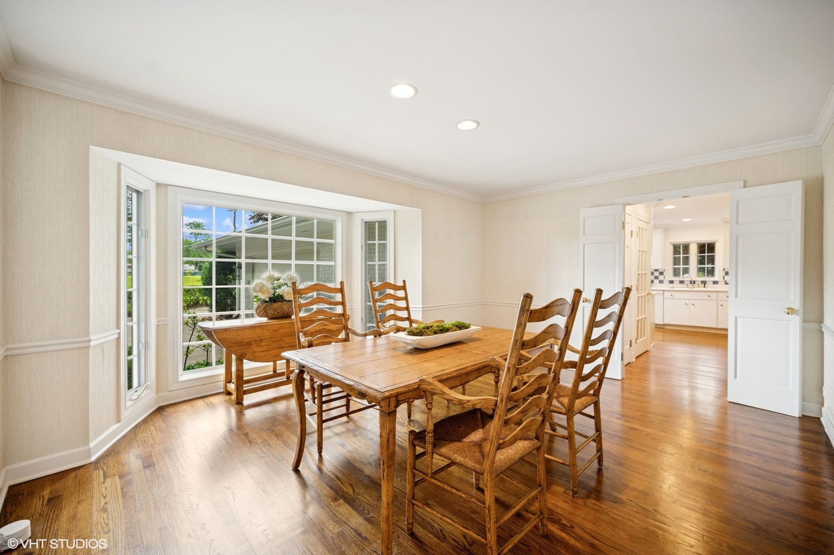 1118 Mt Pleasant Road Winnetka, IL 60093 - Photo 7 of 48 a view of a dining room with furniture and wooden floor