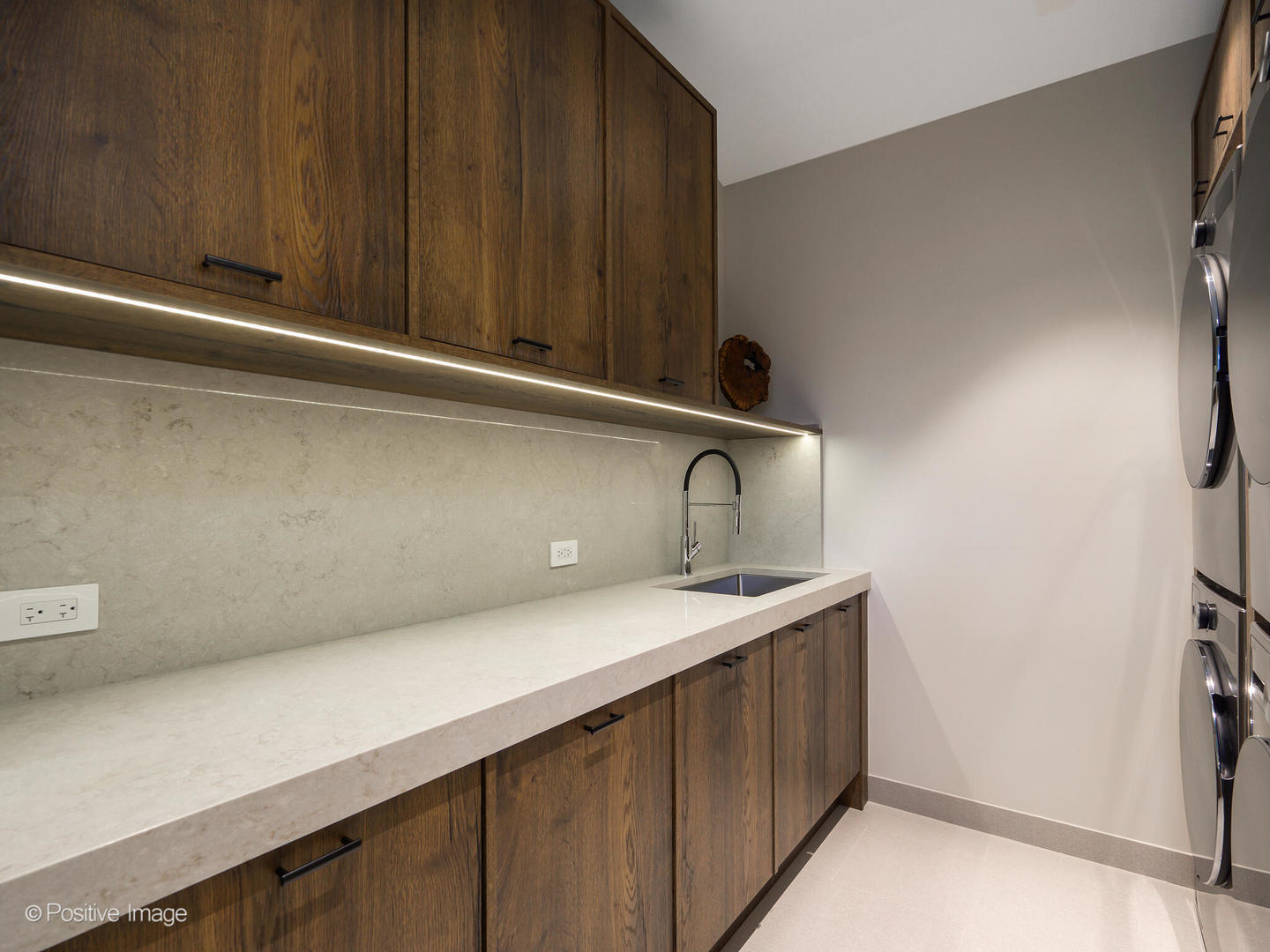 1106 Hohlfelder Road Glencoe, IL 60022 - Photo 17 of 61 a kitchen with a sink and cabinets