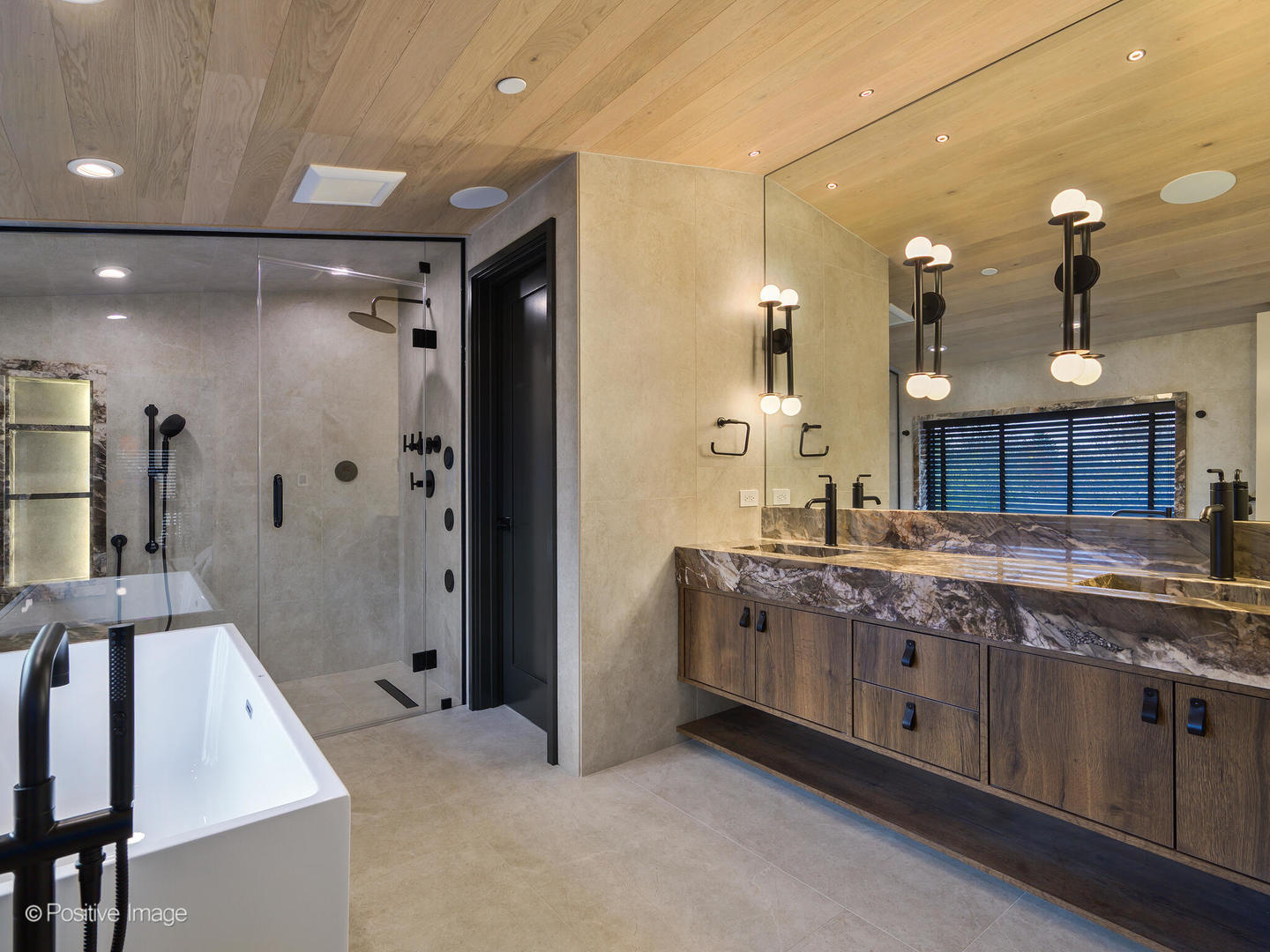1106 Hohlfelder Road Glencoe, IL 60022 - Photo 18 of 61 a spacious bathroom with a granite countertop sink a mirror and a shower