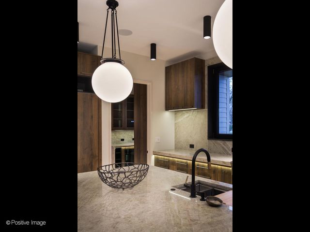 a view of a kitchen area with a sink and cabinets