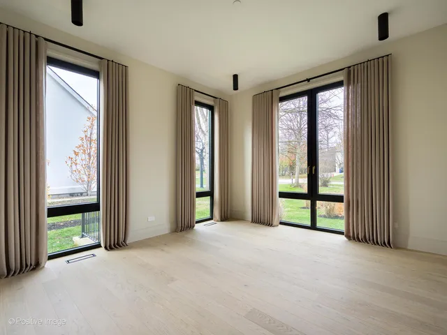 a view of walk in closet and bedroom