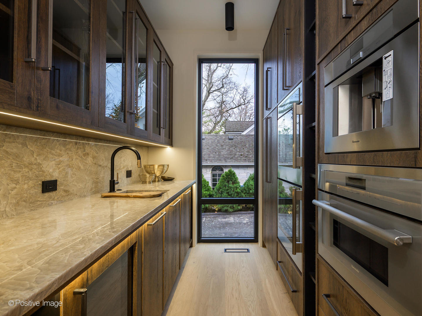 1106 Hohlfelder Road Glencoe, IL 60022 - Photo 37 of 61 a kitchen with a sink stove and cabinets