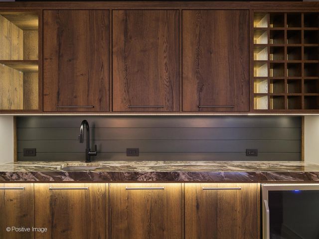 a view of yard from deck with patio