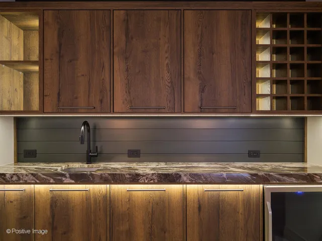 a view of yard from deck with patio