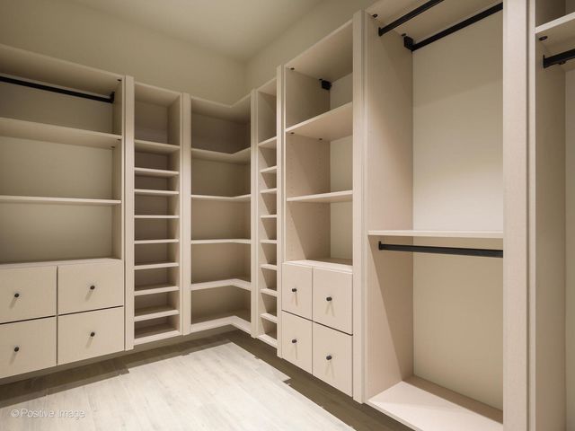 a view of a backyard with a garden and patio