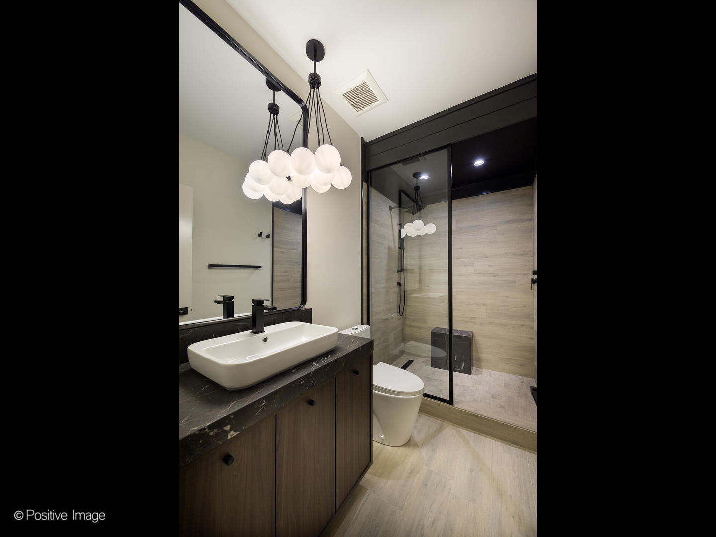 1106 Hohlfelder Road Glencoe, IL 60022 - Photo 49 of 61 a bathroom with a sink mirror and a shower