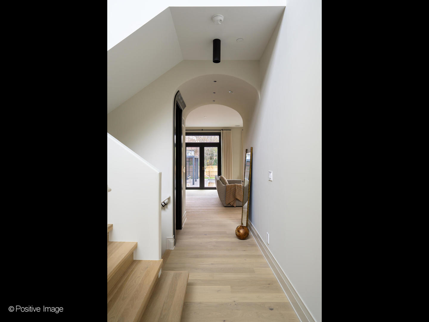 1106 Hohlfelder Road Glencoe, IL 60022 - Photo 6 of 61 a view of a hallway with a white walls and a living room