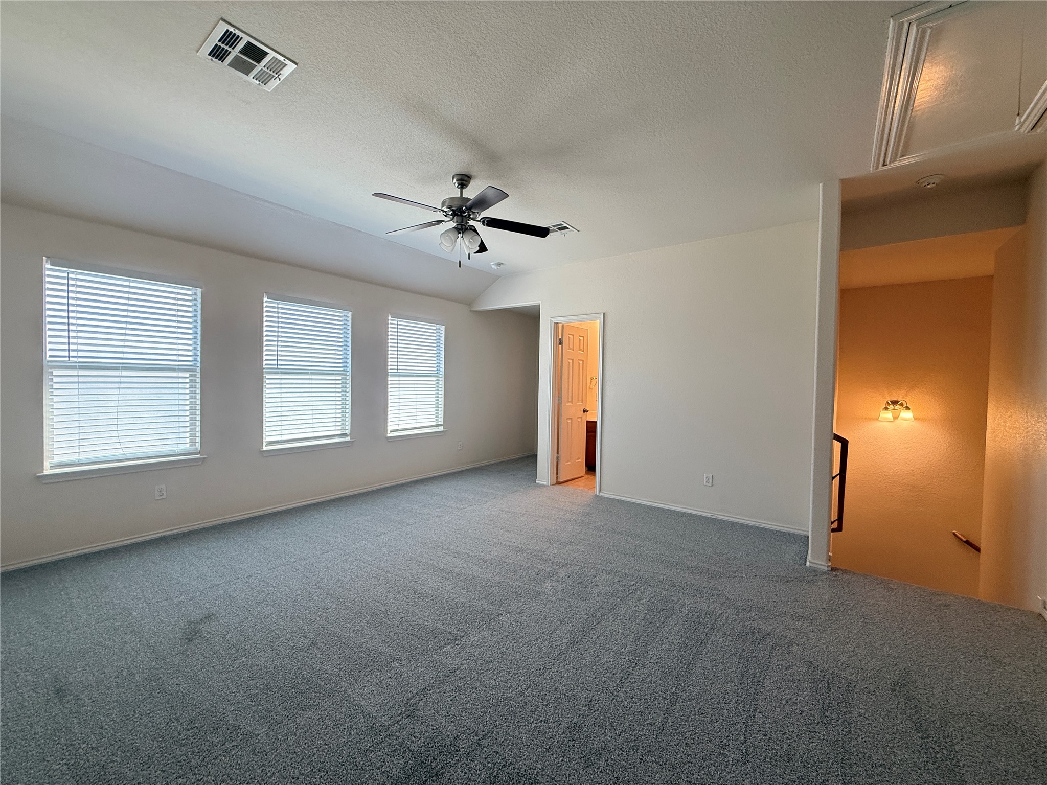 279 Housefinch Loop Leander, TX 78641 - Photo 17 of 30 Unfurnished bedroom featuring carpet floors and a ceiling fan