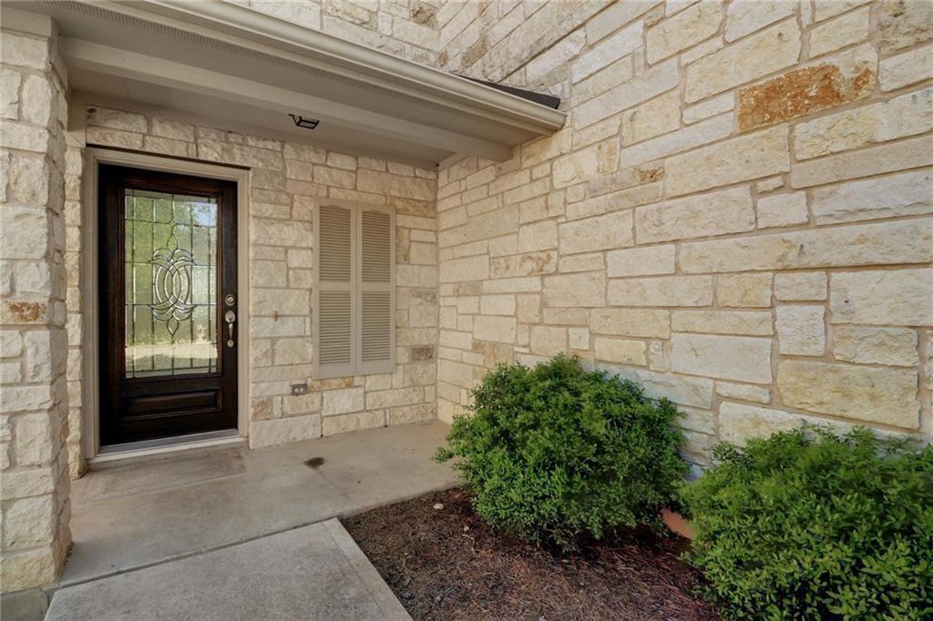 279 Housefinch Loop Leander, TX 78641 - Photo 27 of 30 View of exterior entry featuring stone siding