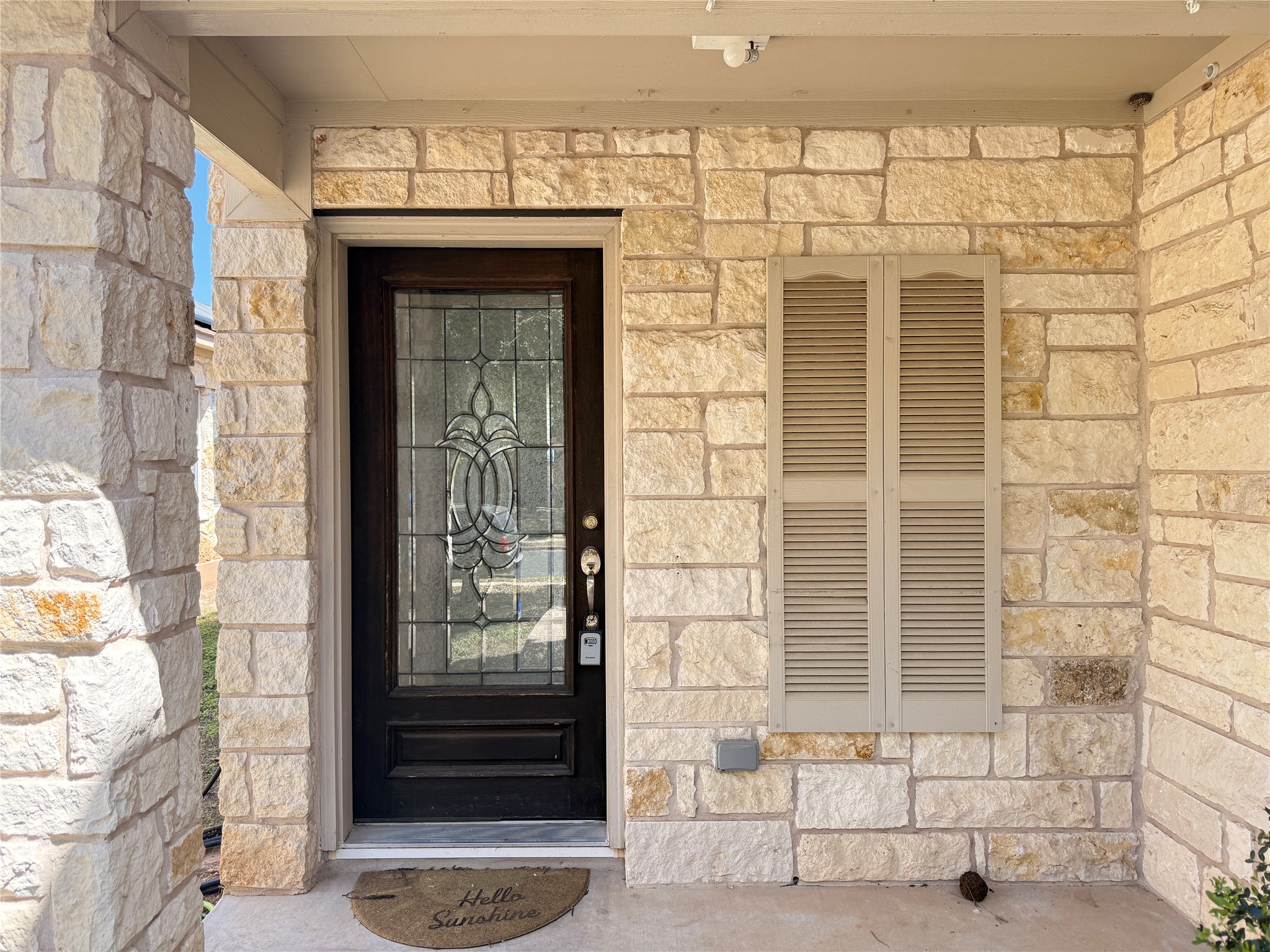 279 Housefinch Loop Leander, TX 78641 - Photo 3 of 30 View of exterior entry with stone siding