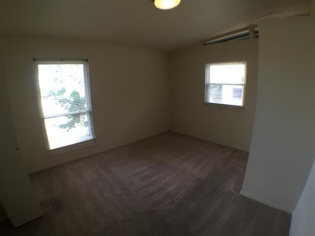 2703 Swisher Street, Unit 203A Austin, TX 78705 - Photo 6 of 11 a view of a window in an empty room