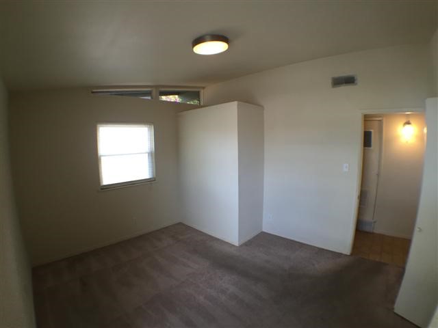 2703 Swisher Street, Unit 203A Austin, TX 78705 - Photo 8 of 11 an empty room with windows and closet