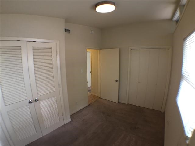 2703 Swisher Street, Unit 203A Austin, TX 78705 - Photo 9 of 11 an empty room with windows