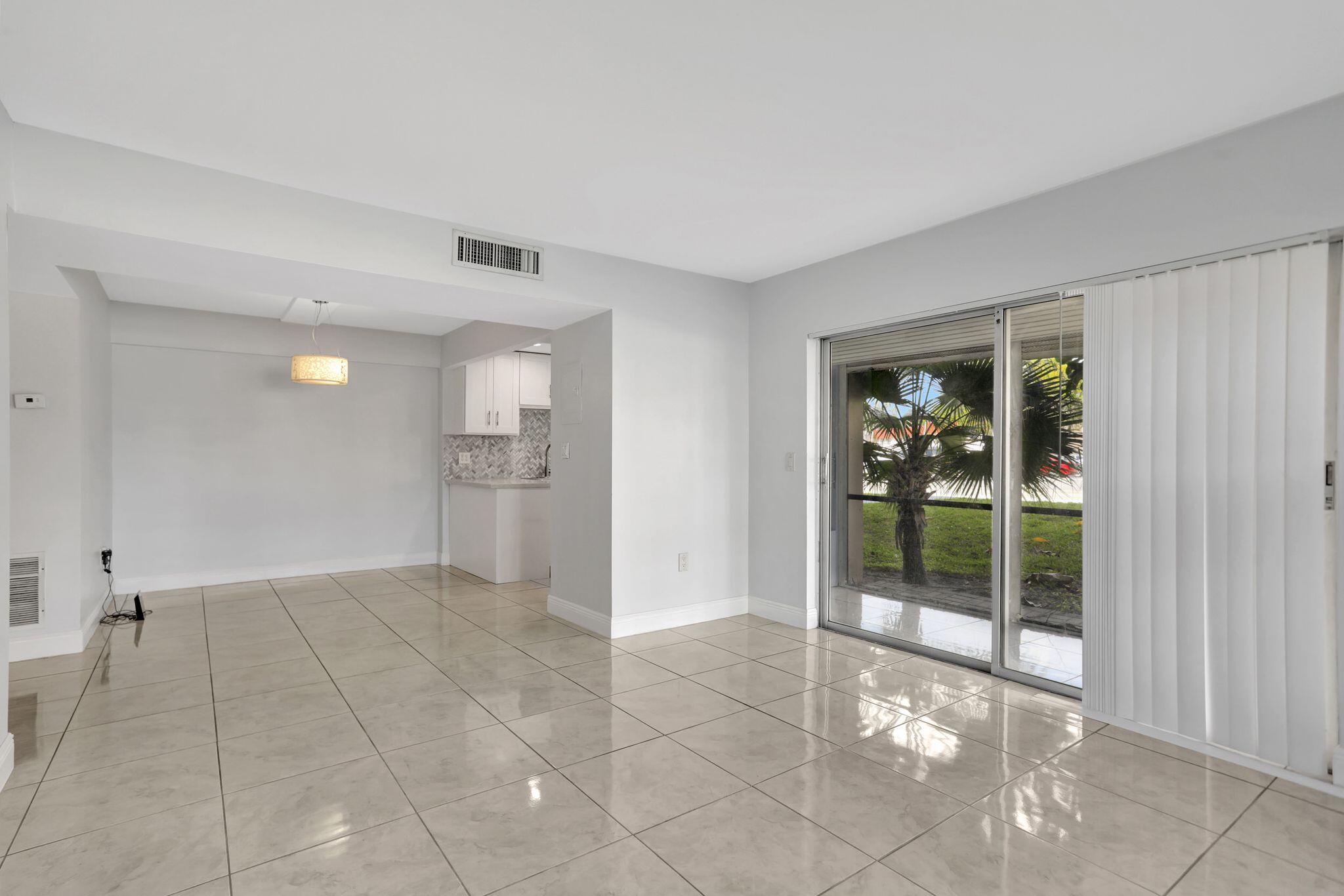 4156 Inverrary Drive, Unit 111 Lauderhill, FL 33319 - Photo 12 of 18 a view of an empty room with a window