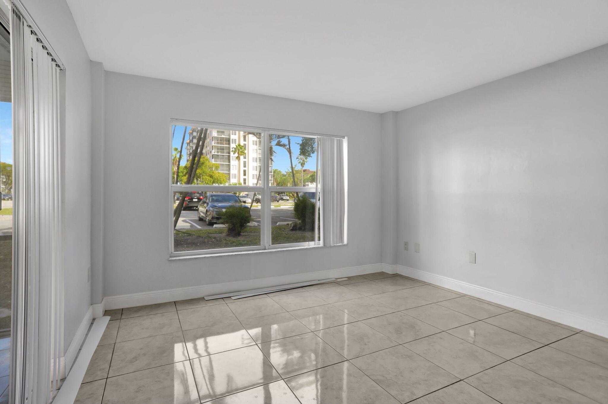 4156 Inverrary Drive, Unit 111 Lauderhill, FL 33319 - Photo 18 of 18 an empty room with windows
