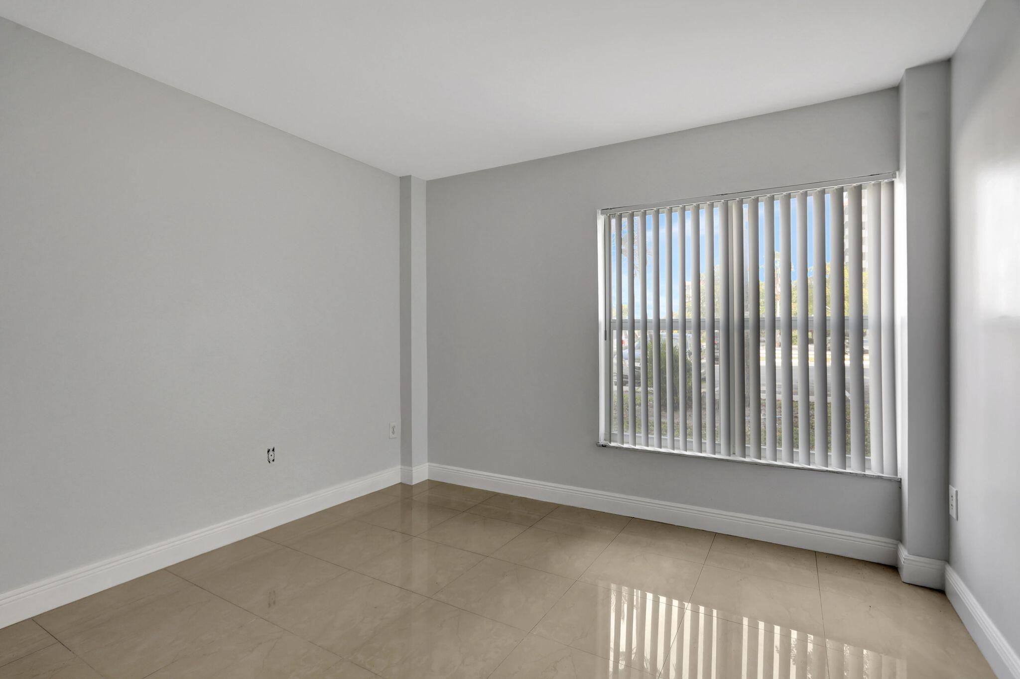 4156 Inverrary Drive, Unit 111 Lauderhill, FL 33319 - Photo 5 of 18 a view of an empty room with a window