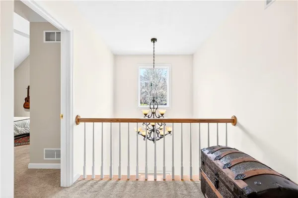 a view of a hallway with windows