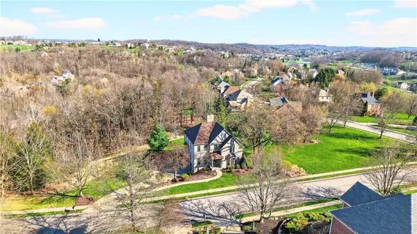 an aerial view of residential house with outdoor space