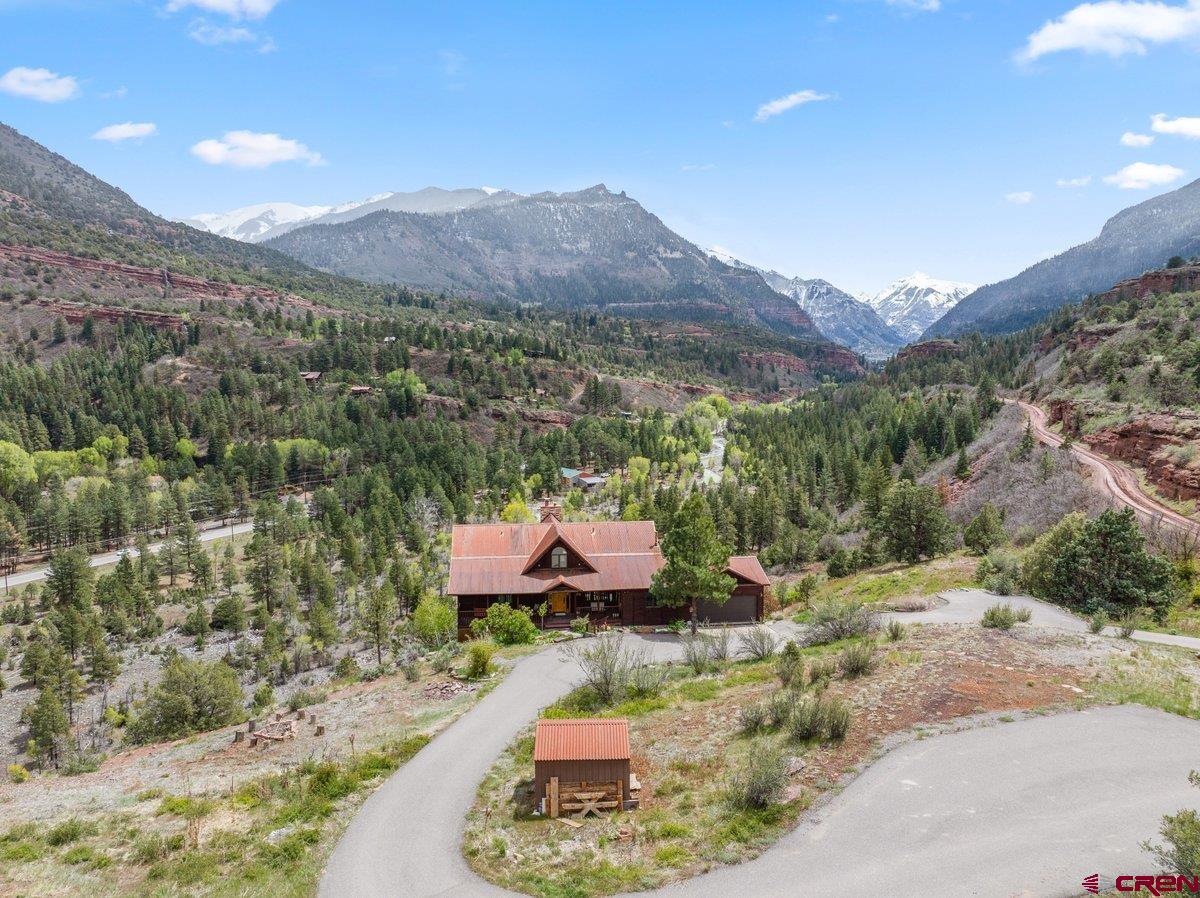 2490 County Road 17 Ridgway, CO 81432 - Photo 24 of 26 a view of a lush green hillside and a houses