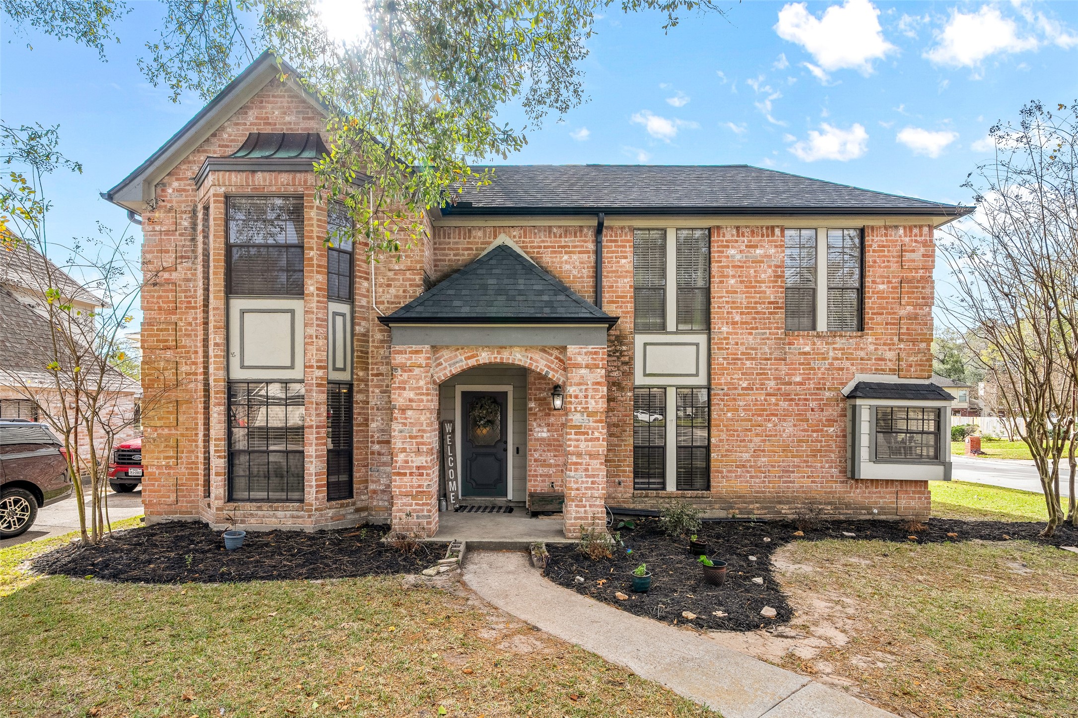 41 Windsor Drive Conroe, TX 77304 - Photo 2 of 39 (Front exterior photo WITHOUT virtual landscape enhancement.)