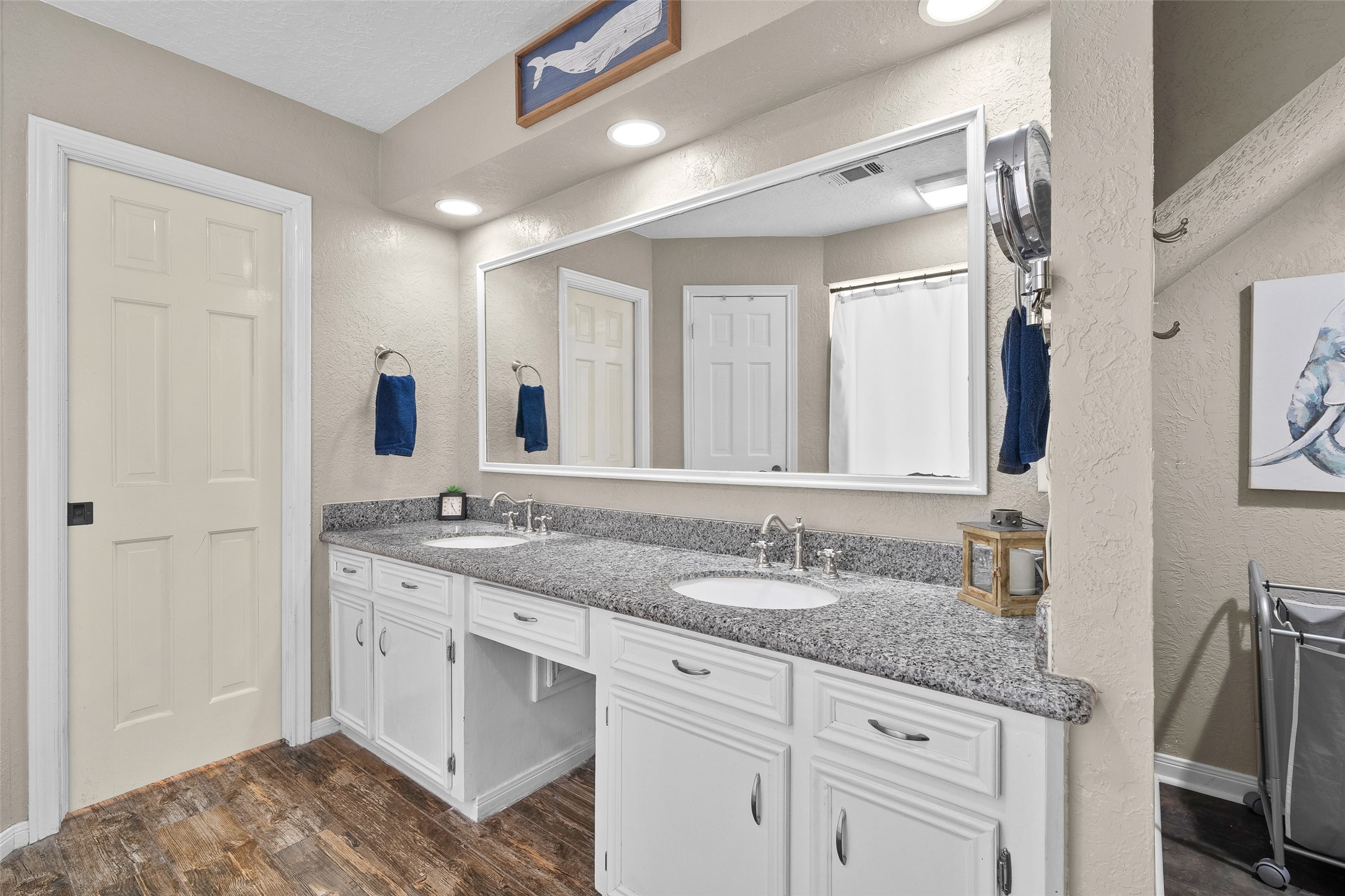 41 Windsor Drive Conroe, TX 77304 - Photo 23 of 39 Primary bathroom with double-sink vanity, granite countertop, and ample cabinet storage.