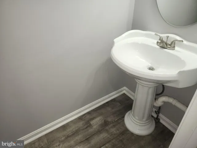 a bathroom with a sink and toilet