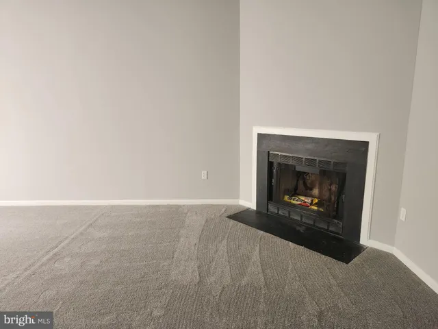 a living room with a fireplace in it