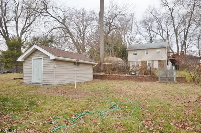 a house with trees in the background