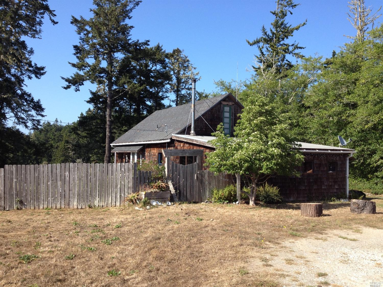 33300 Albion Ridge Road Albion, CA 95410 - Photo 1 of 1 a front view of a house with a yard and garage