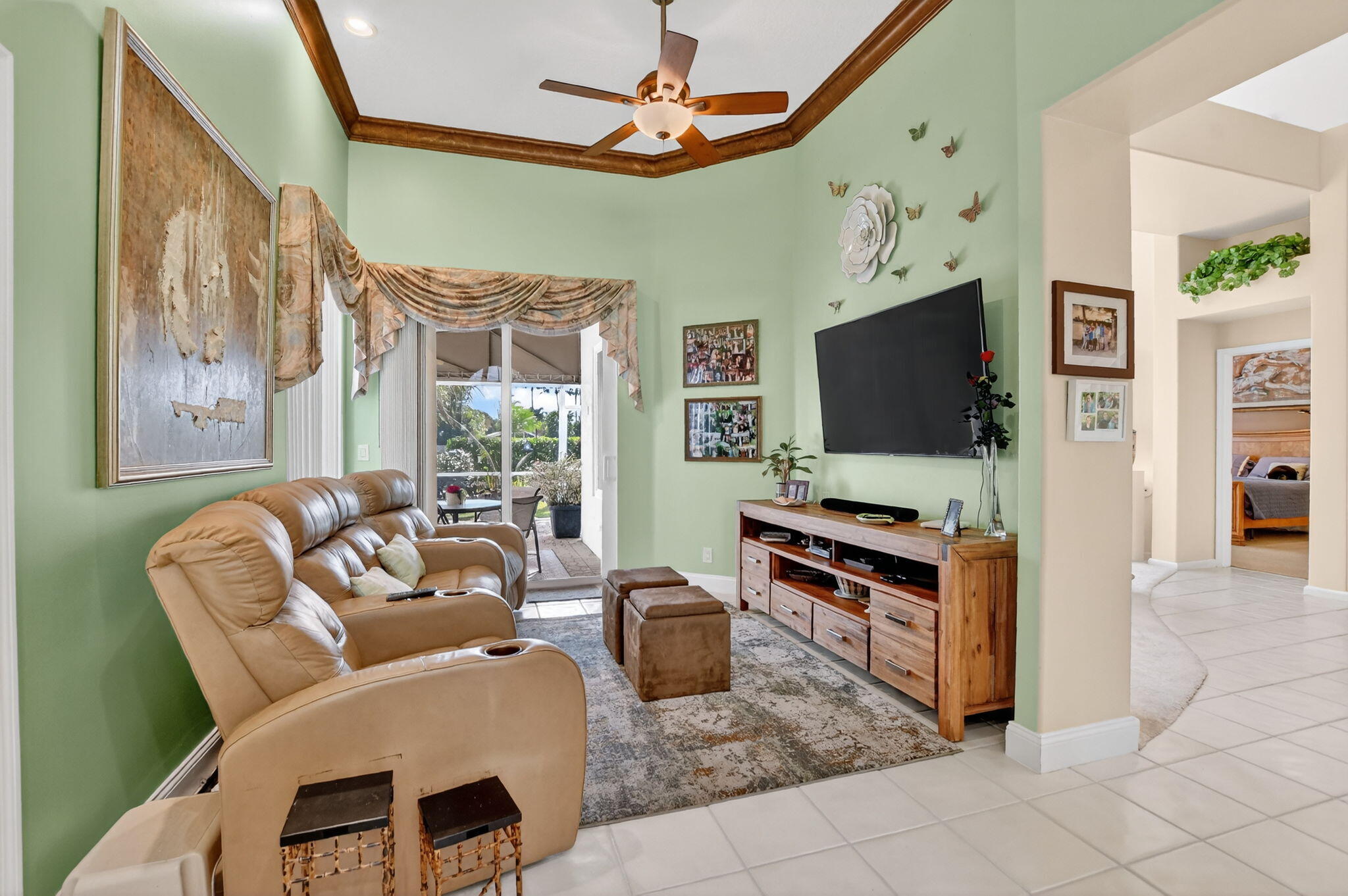 7816 Travelers Tree Drive Boca Raton, FL 33433 - Photo 19 of 61 a living room with furniture and a flat screen tv